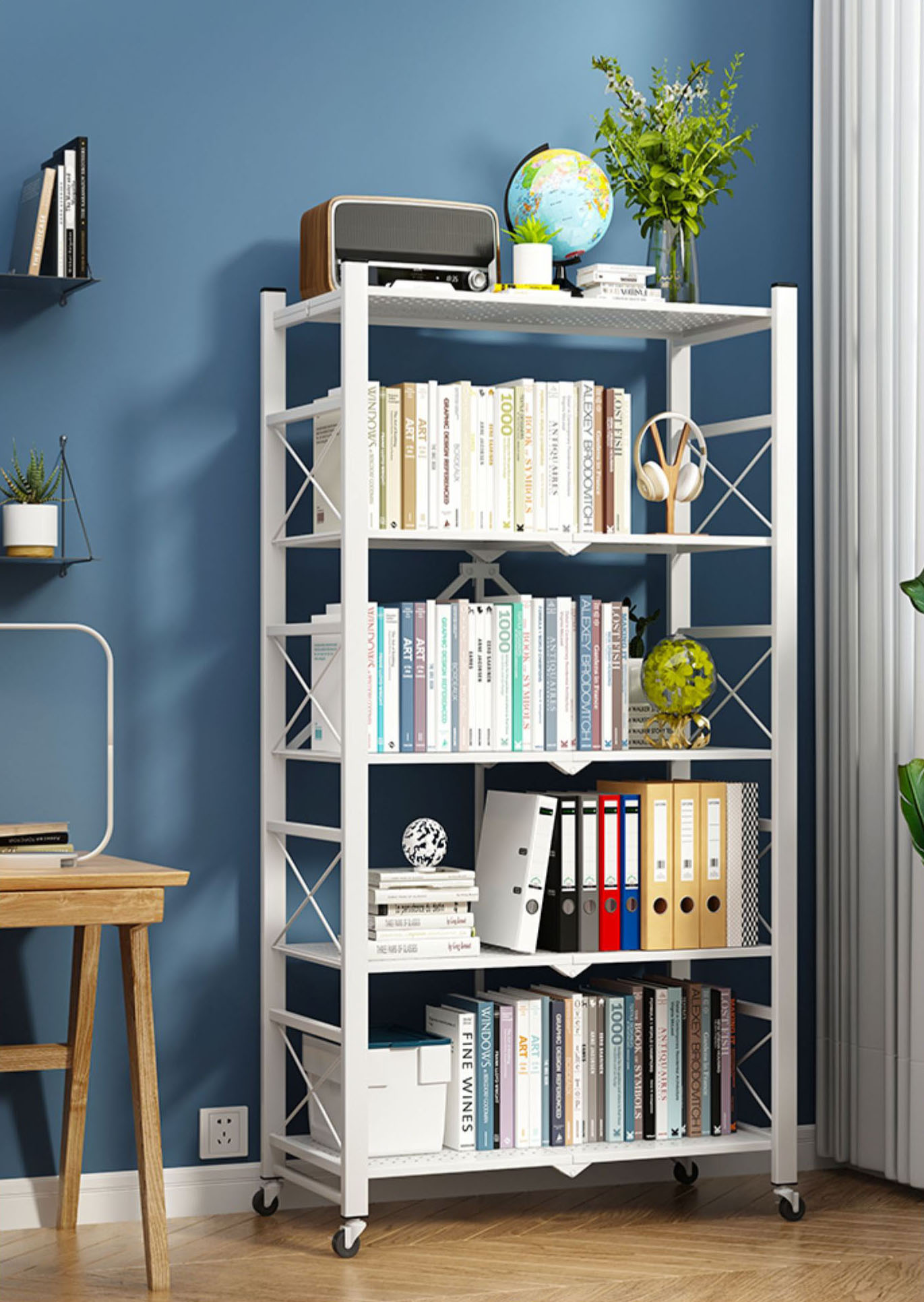 Black foldable rack in a study holding books, files and stationery