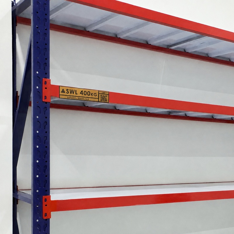 Yellow safe working load label reading SWL 400kg, uniformly distributed, fixed to the orange beam of a warehouse rack at eye level